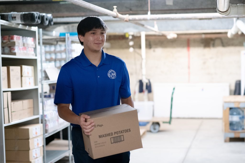 person carrying box of food